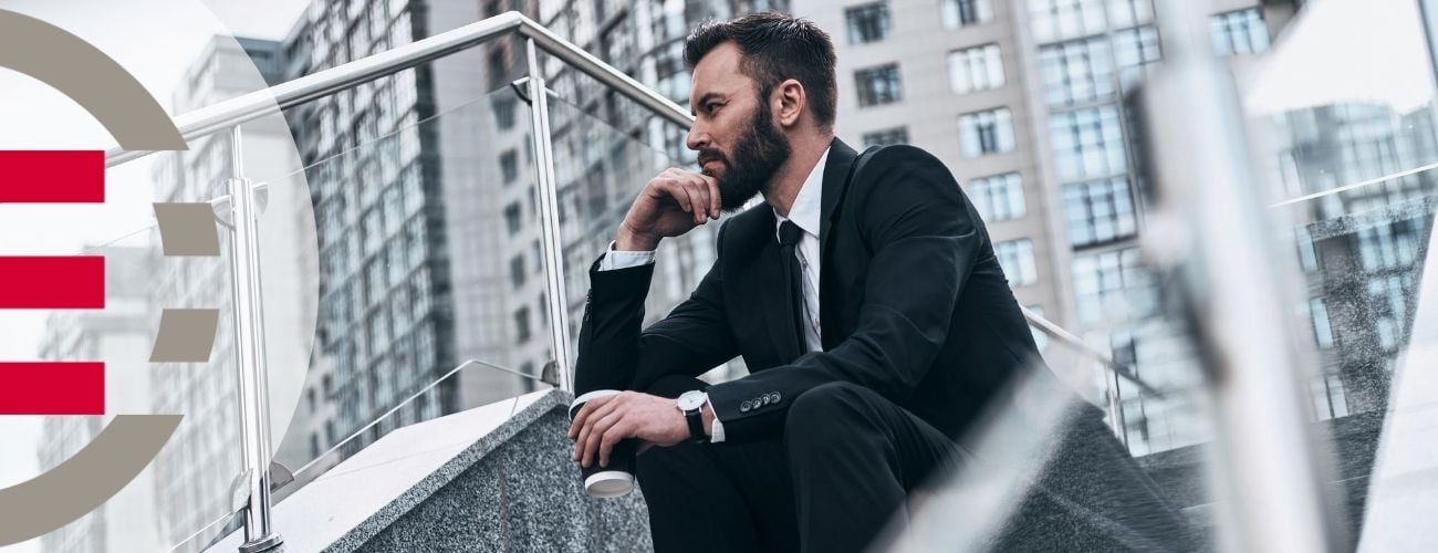 Man sitting on stairs thinking about how to nurture his buyer leads towards a sale